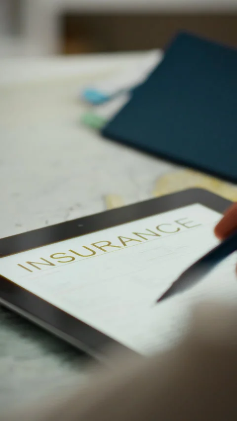 Insurance agent explains important document details to a client in office se Stock Footage 331601589