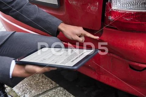 Insurance Agent Filling Insurance Claim Form On Digital Tablet Stock Photos