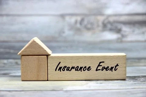 "Insurance Event" text or message short word letter on wood block with wood.. Stock Photos