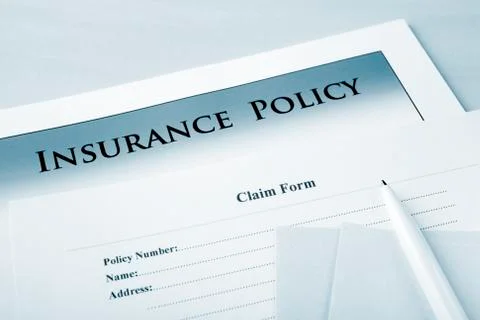 Insurance policy and claim form Stock Photos