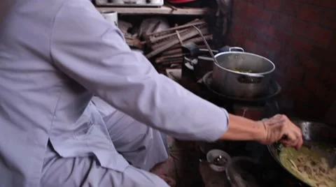 INT Vietnamese kitchen - various angles and shots of women cooking Stock Footage 61070634