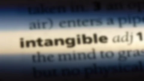 Intangible word in a dictionary. Stock Footage 99561424