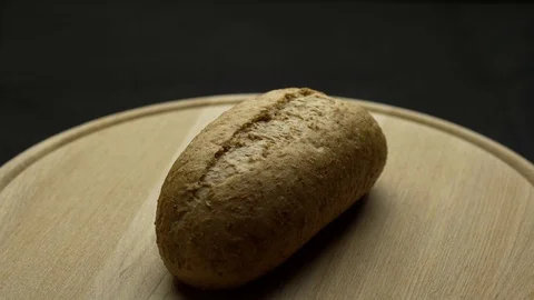 Integral bread on a wooden board Stock Footage 106753405