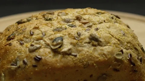 Integral bread on a wooden board Stock Footage 117343506