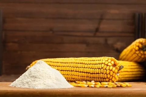 Integral corn flour arranged with corn cob Stock Photos