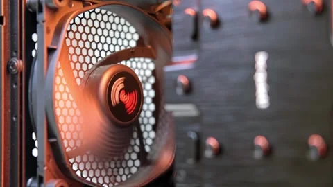An integral part of a computer, a spinning fan in computer case. Cooling system. Stock Footage 252586844