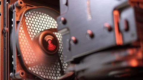 An integral part of a computer, a spinning fan in computer case. Cooling system. Stock Footage 252587084