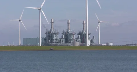 Integrated gasification combined cycle (IGCC) power plant + wind energy Stock Footage 80453953