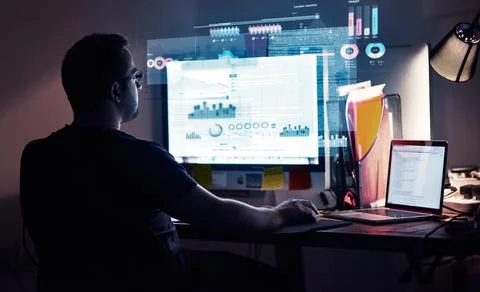 Integrating new code. Cropped shot of a young computer programmer looking Stock Photos