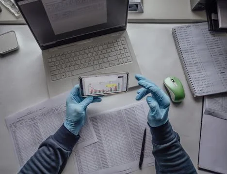 Integration of technology in laboratory research. Desk with hands and laptop Stock Photos
