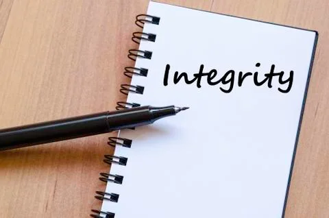 Integrity write on notebook Stock Photos