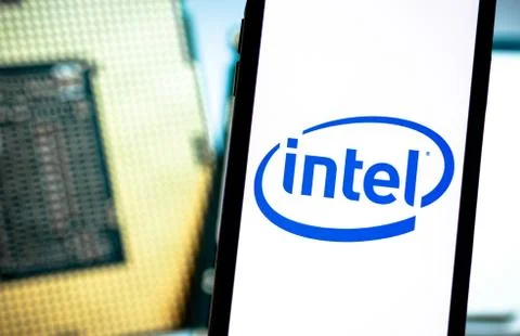 Intel logo on smartphone screen. 스톡 사진