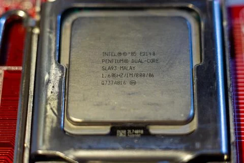 Intel pentium dual core e2140 processor chip mounted in socket on motherboard Stock Photos