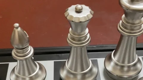 Intellectual chess game board arranged with silver pieces on chess board - Stock Footage 333271857
