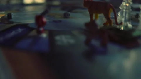 Intellectual Table game about finances. People are playing the game Cashflow Stock Footage 163577127