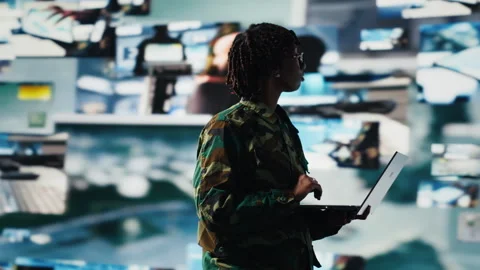 Intelligence agency expert wearing camo uniform scanning enemy rocket Stock Footage 318933314