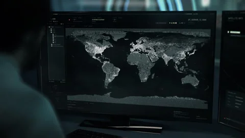 Intelligence Agent Investigates Map In High Tech Satellite Analysis Software Stock Footage 319259113
