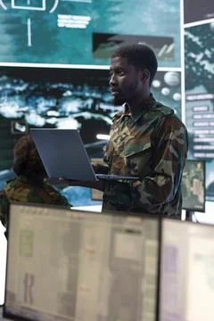 Intelligence analyst technician coordinating air support to provide assistance Stock Photos