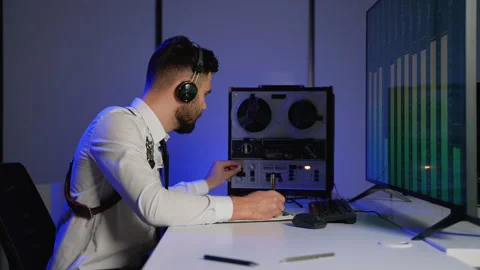 Intelligence officer analyzing intercepted audio and taking notes Stock Footage 305007792
