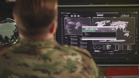 Intelligence officer managing data exchange on computer in command center Stock Footage 335538177