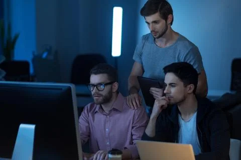 Intelligent handsome programmer working on the computer Stock-Fotos