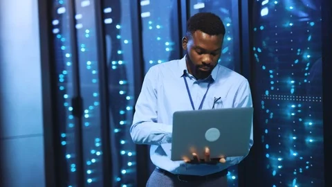 Intelligent IT server engineer working on laptop computer in high tech render Stock Footage 118450274