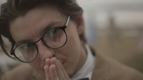 Intelligent man looks camera Stock Footage 89785522