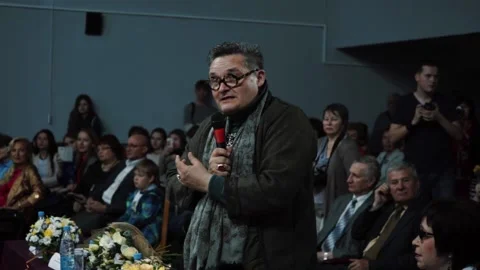 An intelligent man speaks at a creative evening, press conference Stock Footage 130750447