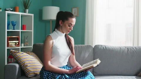Intelligent Woman Is Captivated by Book Plot Stock Footage 164414993