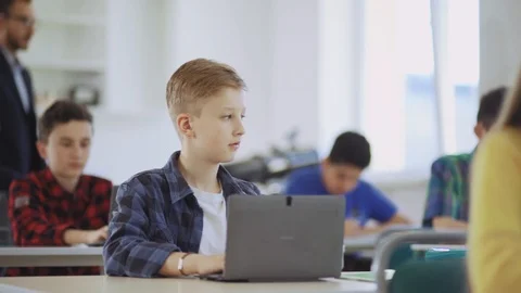 Intelligent young students working like programists on laptops at a computer Stock Footage 111969549