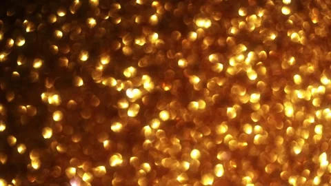 Intense Amber Bokeh Backdrop with Shimmering Light Flares Видео 332073859