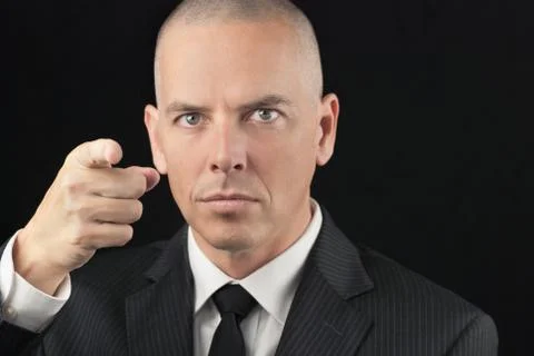 Intense bald man points to camera Stock Photos