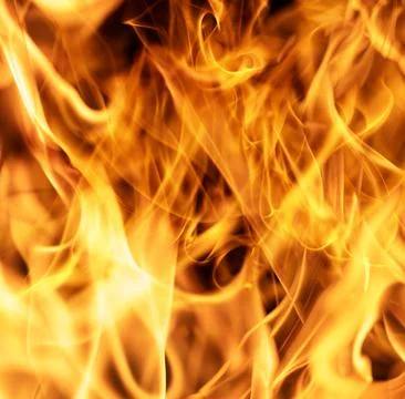 Intense blazing fire background with dramatic flame motion. Fiery explosion Stock Photos