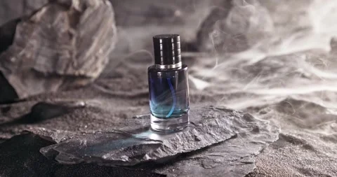 Intense blue perfume in environment rocks and volcanic sand. Video stock 331788785