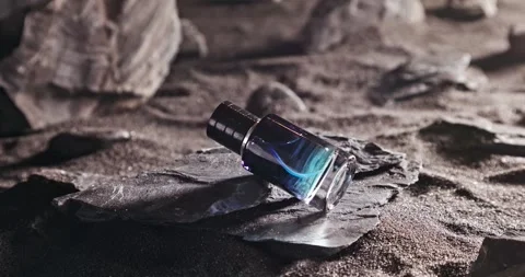 Intense blue perfume in environment rocks and volcanic sand. Stock-Footage 336014500