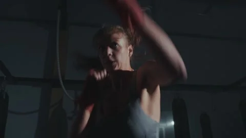 Intense boxing training session at a dimly lit gym during the early morning Stock-Footage 285930086