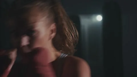 Intense boxing training session at a local gym in the evening with focused 스톡 동영상 283523233