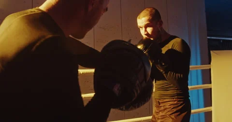 Intense Boxing Training Session in the Ring. Dynamic and Aggressive Boxing Stock-Footage 275608938