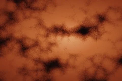 Intense burnt orange abstract texture with black smoky gradients and grainy.. Stock Photos