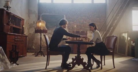 Intense Chess Game Turns into a Heated Emotional Conflict Between a Man and Stockbeeldmateriaal 299546124