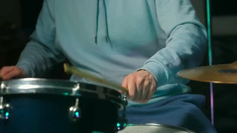 Intense close-up on drummer in studio capturing passion and skill during Stock Footage 312847112