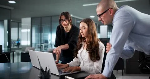 Intense Coding Session: Diverse Team Of Programmers Develop Software Programs Stock-Fotos