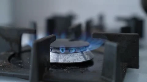 Intense cooking flame, kitchen fire in macro view, heating element on stove Stock Footage 315530980