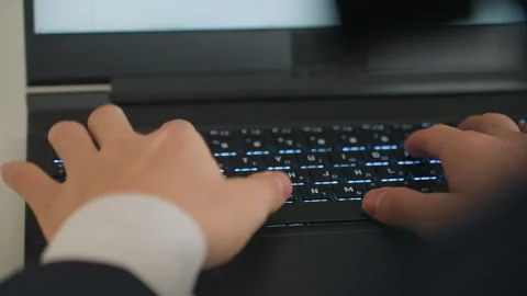 Intense cybersecurity professional concentrating on urgent coding task. Focused Stock Footage 337233526