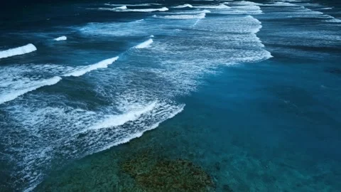 Intense dark waves with white foam, aerial view of breaking surf, barrier reef Stock Footage 274371854
