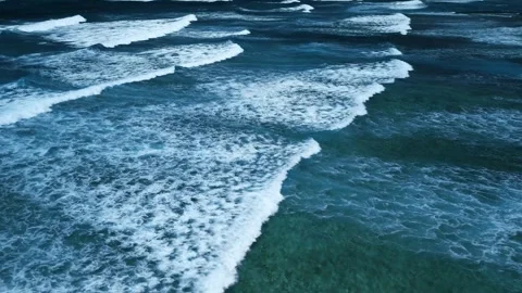 Intense dark waves with white foam, aerial view of breaking surf, barrier reef Stock Footage 274372248