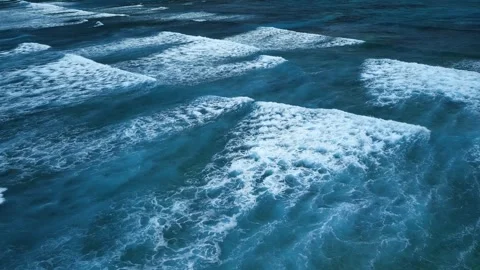 Intense dark waves with white foam, aerial view of breaking surf, barrier reef Stock Footage 274372301