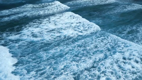 Intense dark waves with white foam, aerial view of breaking surf, barrier reef 動画素材 274372441