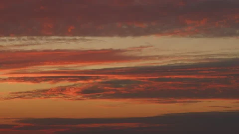 Intense dramatic panoramic sunset. Abstract different shades clouds at sunset Stock Footage 218988336