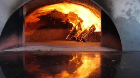 Intense Fire Burning Inside Traditional Italian Wood-Fired Pizza Oven Video stock 337676601